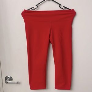 Reddish orange Alo yoga crop pants